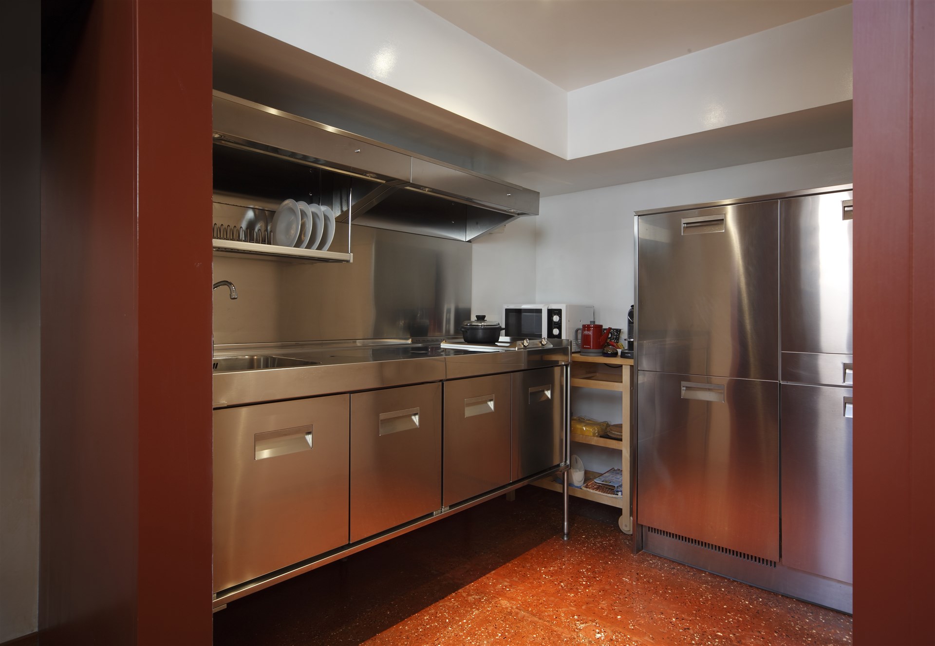 08-The-stainless-Kitchen-has-been-supplied-with-all-the-modern-comfort-microwave-oven-dishwasher-washing-machine-kettle-and-Nespresso-coffee-maker